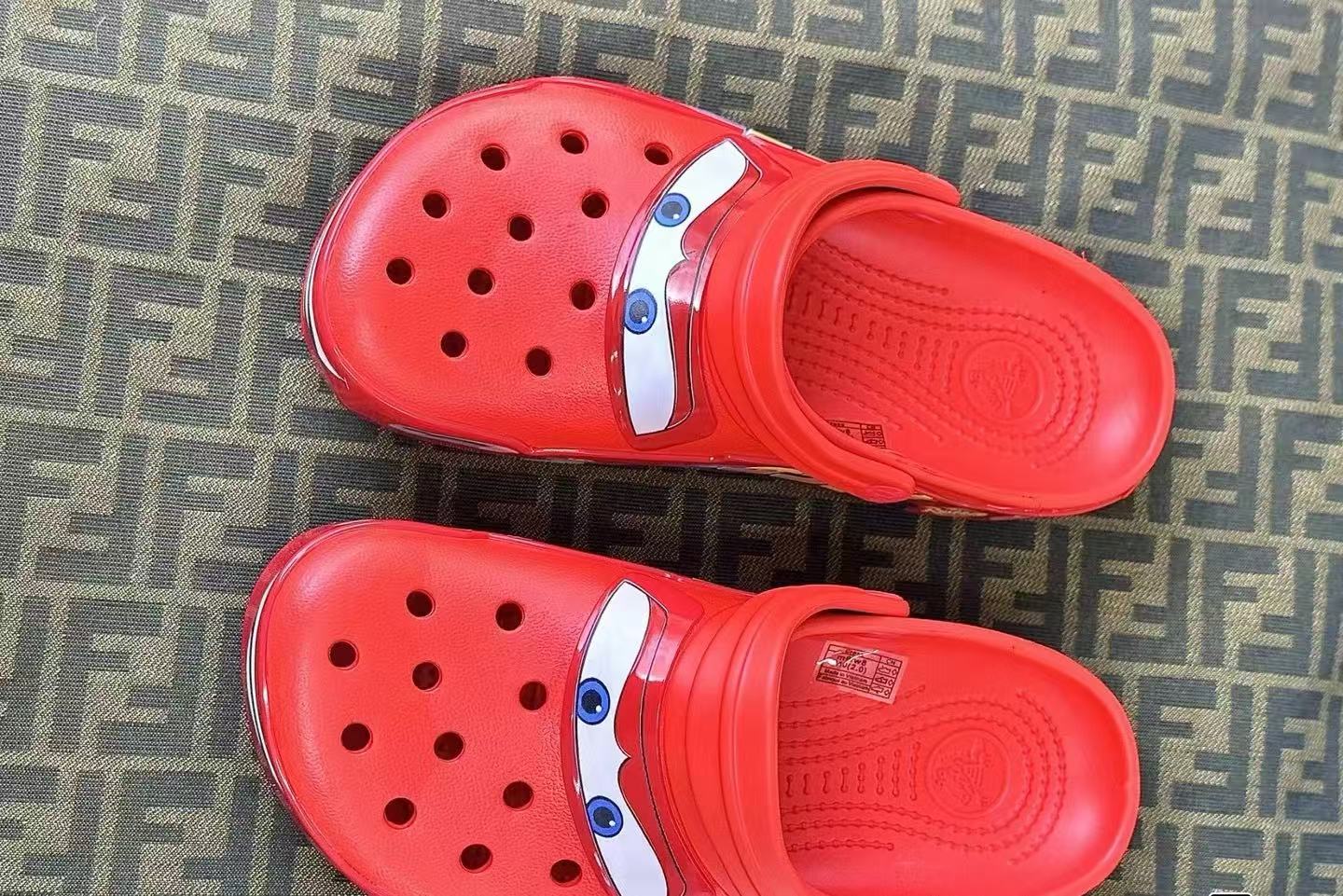 Red racing cartoon clog shoes top view